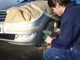 photo of Sprintfinish operative mending a car